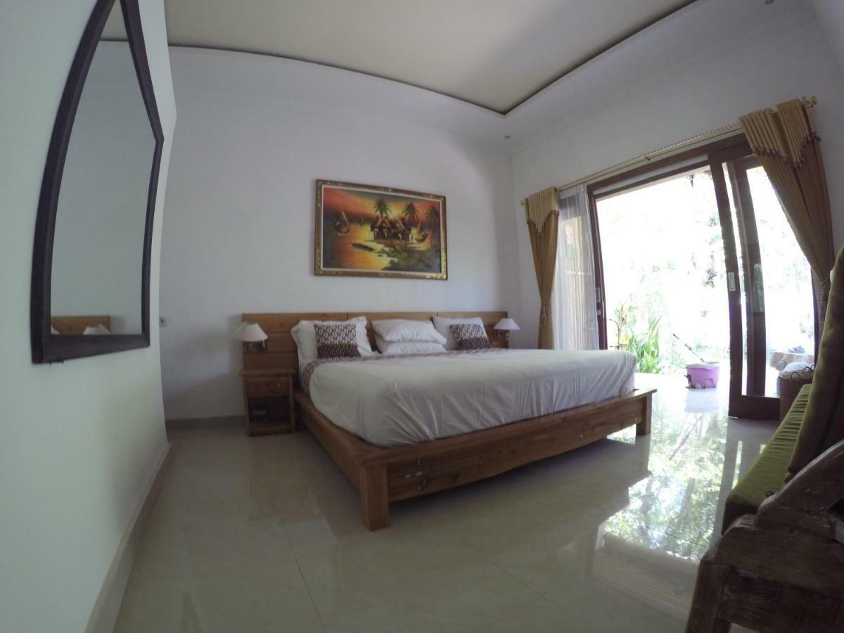 Rumah Made Amed Esterno foto